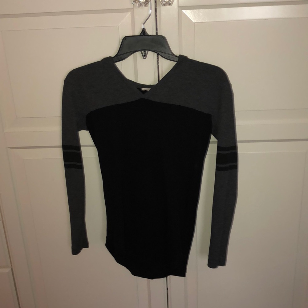 A grey and black hooded top